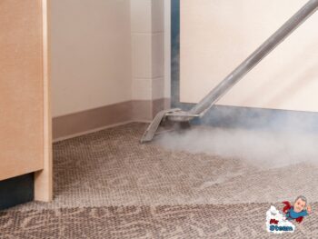 steam blowing out of a carpet cleaning wand