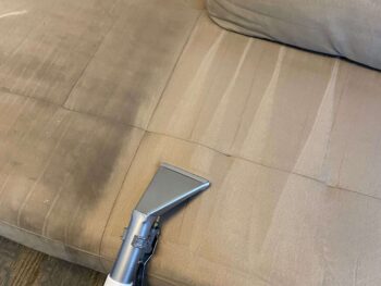 A couch being cleaned